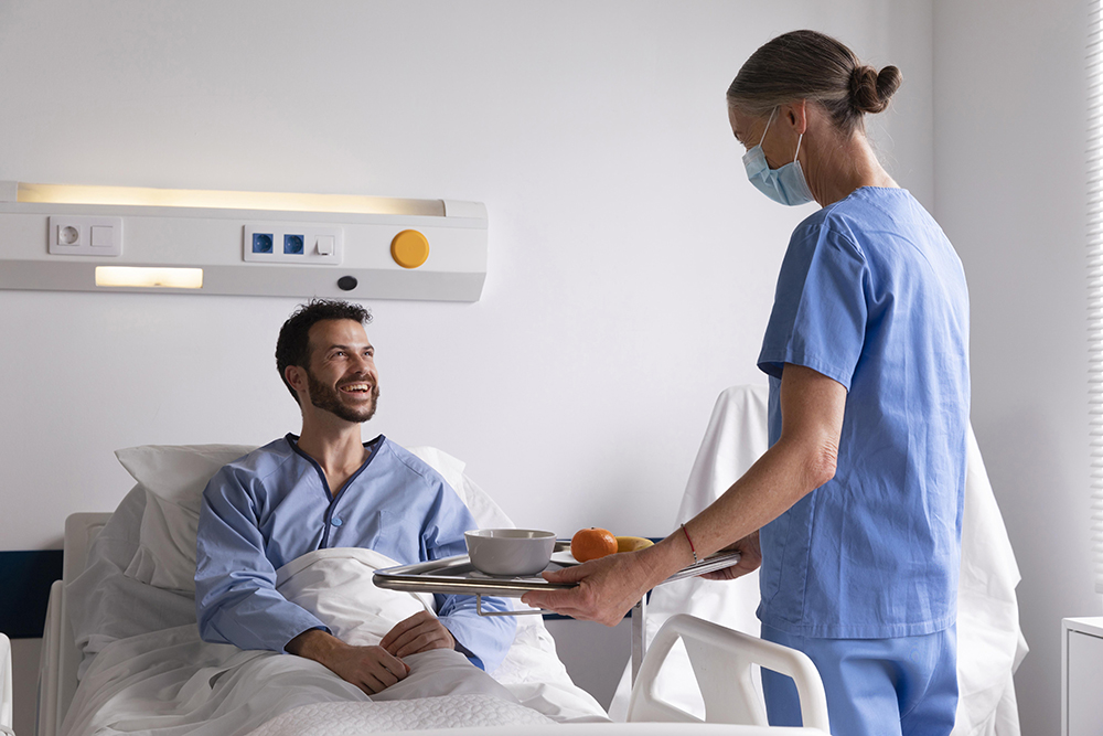 male-patient-bed-talking-nurse